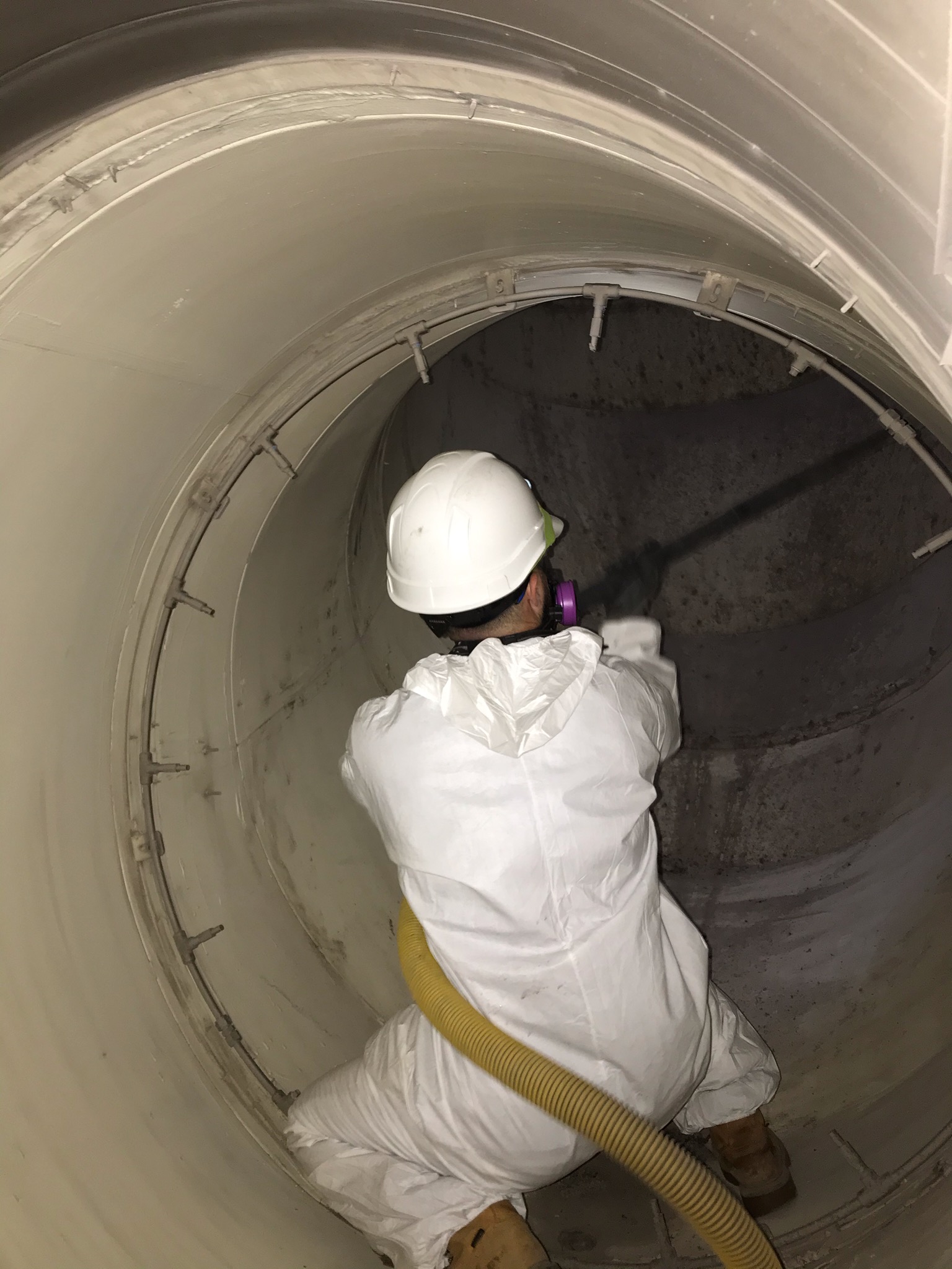 SaniTech technician cleaning commercial air ductwork